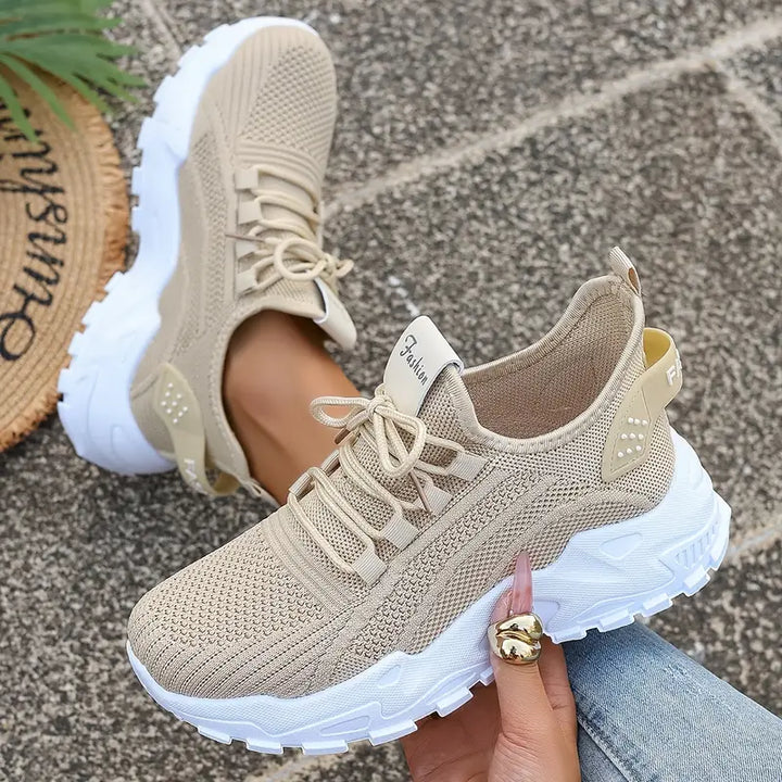 Women's grey orthopedic sneakers with shock-absorbing soles, non-slip, breathable design for comfort and stylish support.