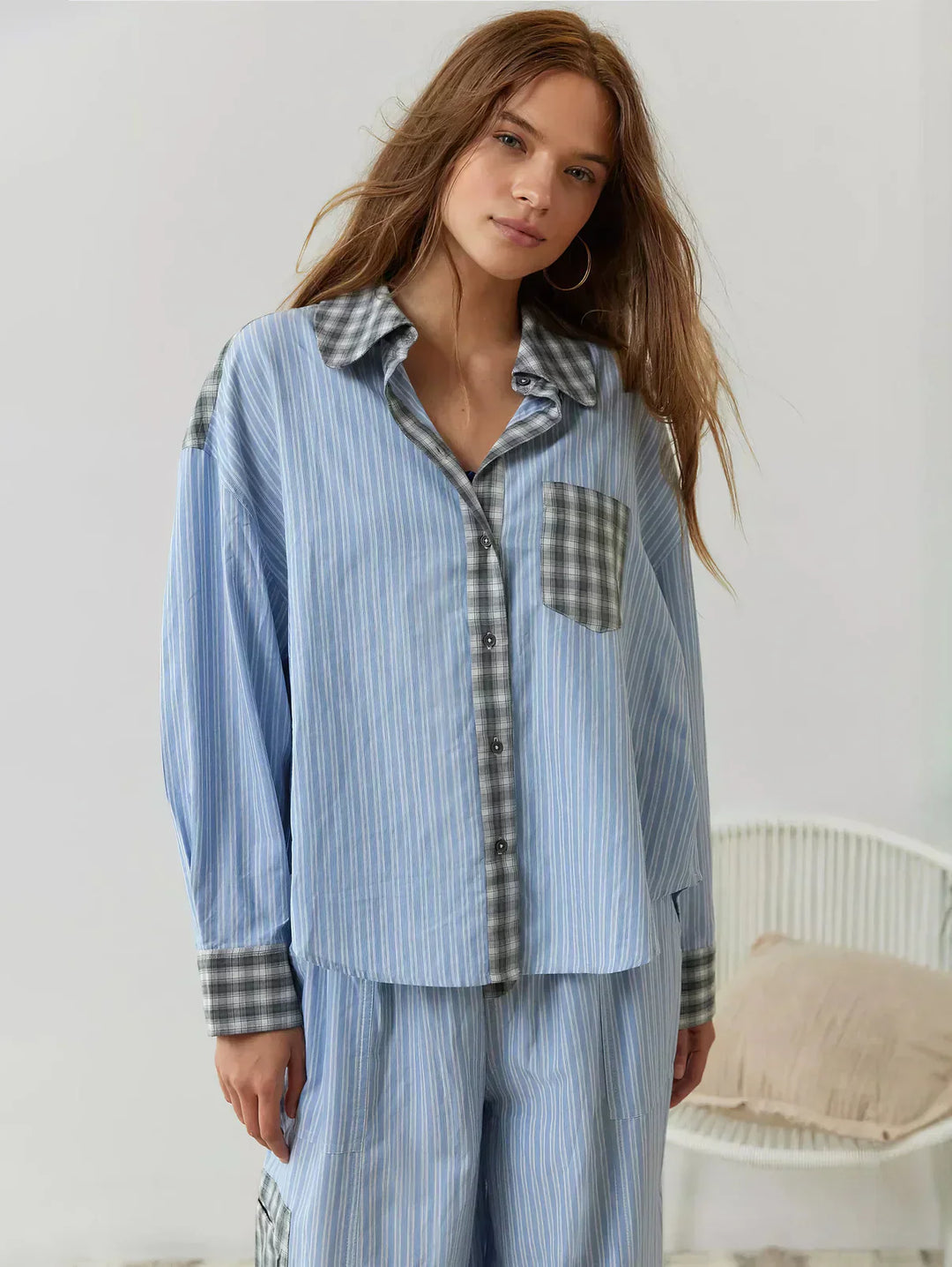 "Women's pink pajama set with elegant patterns, cozy relaxed fit, top and bottom included for stylish loungewear comfort."