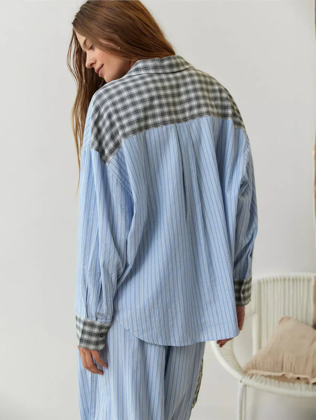 "Women's pink pajama set with elegant patterns, cozy relaxed fit, top and bottom included for stylish loungewear comfort."
