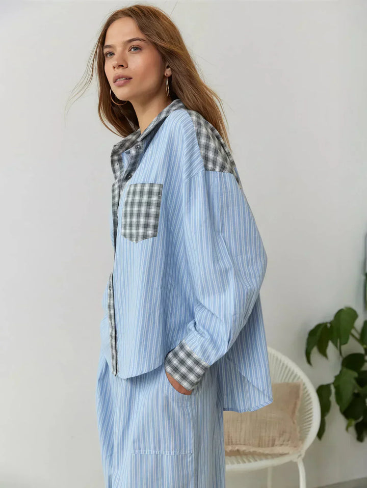 "Women's pink pajama set with elegant patterns, cozy relaxed fit, top and bottom included for stylish loungewear comfort."